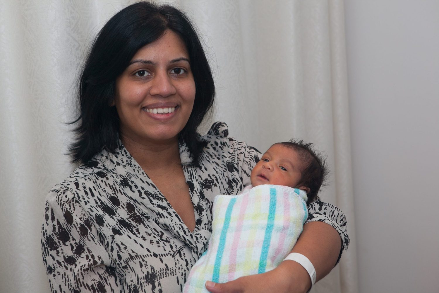 A mother holding her newborn